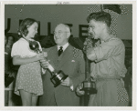 Contests - Super Girl and Super Man contest winners with Harvey Gibson