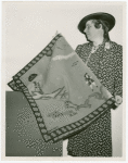 Contests - America through the Needle's Eye - Woman with embroidered tapestry