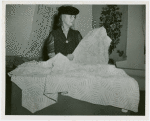 Contests - America through the Needle's Eye - Woman with knitted bedspread