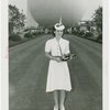 Contests - Beauty - Miss New York World's Fair - Winner in Trylon and Perisphere hat with trophy in front of Perisphere
