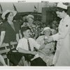 Contests - Crocheting - Nurse applying bandage to contestant