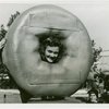Contests - Doughnut - Girl with head in giant doughnut