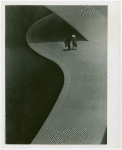 Contests - Photograph - Prizewinning photograph of couple walking in the shadow of the Trylon