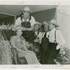 Continental Baking Co. - Harvest Queen receiving crown from James Montgomery Flagg while Grover Whalen and M. Lee Marshall (President, Continental Baking Co.) look on