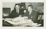 Continental Baking Co. - Building - Grover Whalen, M. Lee Marshall (President, Continental Baking Co.) signing contract on top of building model