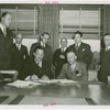Cosmetics - Grover Whalen and Herman L. Brooks (President, Perfumery and Cosmetic Exhibits) signing contract