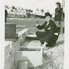 Cosmetics - Strong Box - H. Gregory Thomas holding item