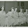 Coty - Female Guides - In identical dresses.