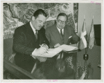Dominican Republic Participation - Grover Whalen and Charles H. Wanzer (Dominican Chamber of Commerce) sign contract