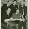 Dominican Republic Participation - Grover Whalen, Charles H. Wanzer (Dominican Chamber of Commerce) and Rafael Leonidas Trujillo Molino (President, Dominican Repubilc) look at contract