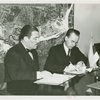 Estonian Consul General Charles Kuusik and Grover Whalen sign contract