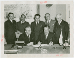 Egypt Participation - Hussein Sabry Pacha (Egyptian High Commissioner) and Grover Whalen sign contract with group looking on