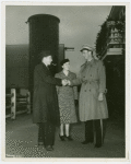 Electric Utilities - Electrified Farm - Mr. Moulton (Farm manager) and wife shake hands with Fair guard