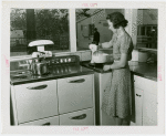 Electric Utilities - Electrified Farm - Woman in kitchen