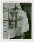 Electric Utilities - Electrified Farm - Mrs. Moulton gets food from refridgerator