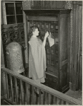 Electric Utilities - Woman filing in office