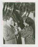 Elgin National Watch Co. Participation - Gladys Swarthout looks into telescope