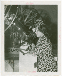 Elgin National Watch Co. Participation - Gladys Swarthout looks into telescope