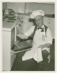 Elmer (NYWF mascot) - Taking pie out of oven