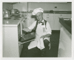 Elmer (NYWF mascot) - Taking pie out of oven