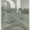 Fairgrounds - Landscaping - Women standing in flowers in front of Trylon and Perisphere