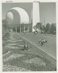 Fairgrounds - Landscaping - Women standing in flowers in front of Trylon and Perisphere