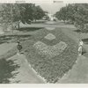 Fairgrounds - Landscaping - Two women view flower garden