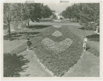 Fairgrounds - Landscaping - Two women view flower garden