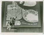 Fairgrounds - Maps and Plans - Women looking at giant general plan of World's Fair