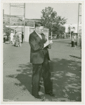 Fairgrounds - Visitors - Man writing in book