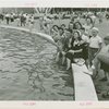 Fairgrounds - Visitors - Man and woman sitting by Court of Light pool