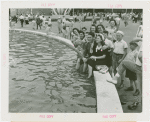 Fairgrounds - Visitors - Man and woman sitting by Court of Light pool