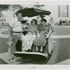 Fairgrounds - Visitors - Family in American Express cart