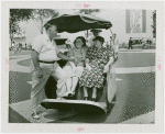 Fairgrounds - Visitors - Family in American Express cart