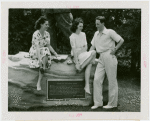 Fairgrounds - Visitors - Women sit on rock inscribed with Walt Whitman poem