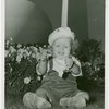 Fairgrounds - Visitors - Baby sitting in grass with Trylon and Persisphere in background