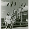 Fairgrounds - Visitors - Two women sitting on handrail of bridge