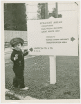 Fairgrounds - Visitors - Child at directional sign
