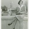 Fairgrounds - Visitors - Woman sits on wall with George Washington statue in background