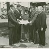 Fairgrounds - Visitors - Director presenting document group