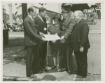 Fairgrounds - Visitors - Director presenting document group