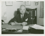 Fairgrounds - Visitors - Man at desk