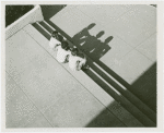 Fairgrounds - Visitors - Three boys sit on steps