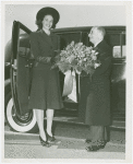 Fairgrounds - Visitors - Woman receiving flowers as she exits car