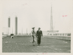 Fairgrounds - Visitors - Woman and man on building roof