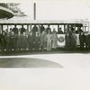 Fairgrounds - Visitors - Group of men in front of NYWF tour bus