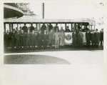 Fairgrounds - Visitors - Group of men in front of NYWF tour bus