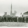 Fairgrounds - Visitors - Group of men with Trylon and Perisphere under construction in background