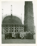 Fairgrounds - Visitors - Coach Fritz Crisler and University of Michigan football squad in front of Trylon and Perisphere under construction