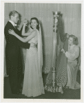 Fashion, World of - Couple dances while woman plays harp